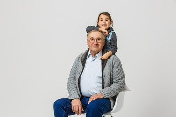 Senior man and granddaughter