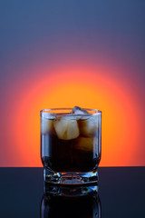 coca cola in a glass with ice