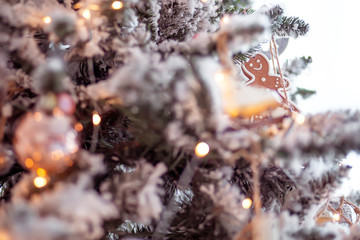 toy gingerbread man hanging on a Christmas tree