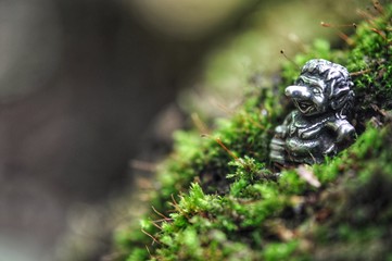 troll toy in forest