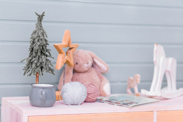 Toys and New Year's decor in the children's room on the table