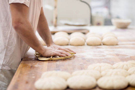 bakery worker preparing the dough