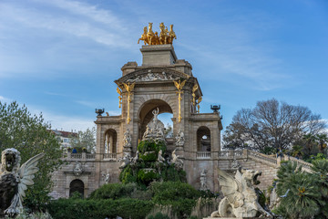 Fototapeta na wymiar Golden horses and gargoyles in the Citadel Park, Located in the neighborhood of La Ribera, the Ciutadella Park is the largest park in Barcelona. Spain