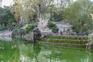 Fototapeta na wymiar Golden horses and gargoyles in the Citadel Park, Located in the neighborhood of La Ribera, the Ciutadella Park is the largest park in Barcelona. Spain