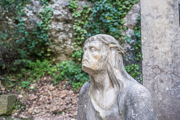 Fototapeta na wymiar sculpture of jesus on the cross made in stone in the monastery of Montserrat in Barcelona, Spain