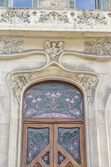 carved stone with flowers and sculptures, Facades and traditional architecture in the old town of Barcelona, Spain