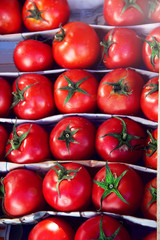Set of various colorful fresh fruits in tray on street.