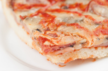 A delicious homemade pizza on a plate isolated on a white background