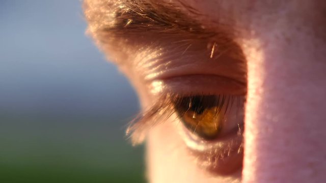 The eye of a young man on a sunny day, super close up