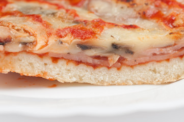 A delicious homemade pizza on a plate isolated on a white background