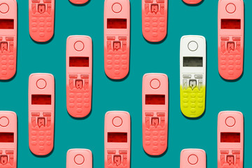 Pattern image of DECT phones turning into a toy phones on blue background. The concept of...