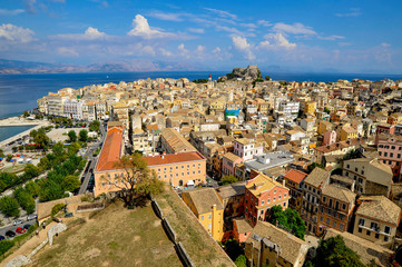 Naklejka premium Filled with sunlight Kerkyra guard two fortresses on high rocks.