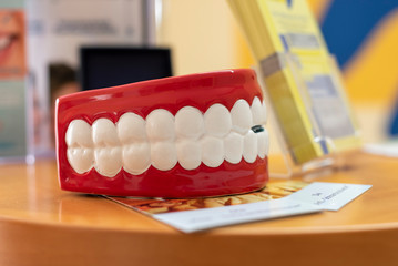 Dentist show dental retainer orthodontic appliance in his hand