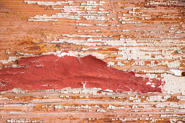 Red paint chip Vintage worn wood grain texture background surface