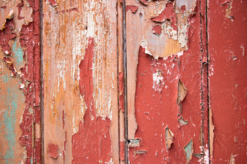 Red paint chip Vintage worn wood grain texture background surface