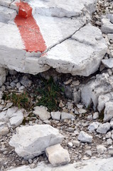 White and red paint to indicate the mountain path in Dolomites protected by UNESCO