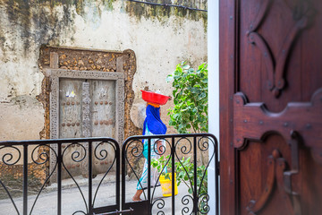 doorway into life in the alley-ways of stone town zanzibar