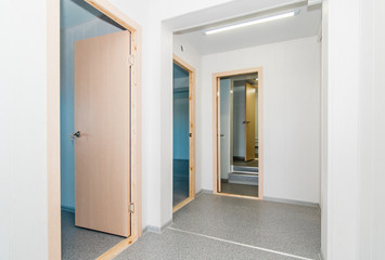 Light white empty office room with bright lighting