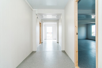 Light white empty office room with bright lighting