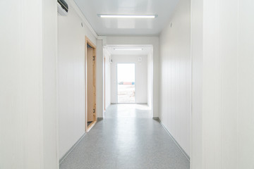 Light white empty office room with bright lighting