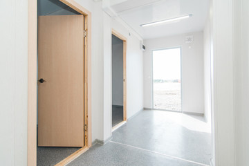 Light white empty office room with bright lighting