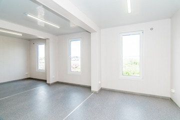Light white empty office room with bright lighting