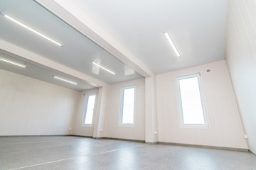 Light white empty office room with bright lighting