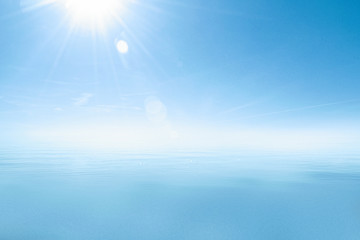 The background of sea landscape. White blue background of ocean and sky in the bright sunlight.