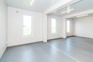 Light white empty office room with bright lighting