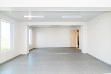 Light white empty office room with bright lighting