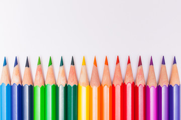 Colored pencils on white background