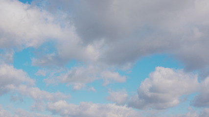 White clouds floating in the blue sky.