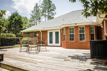 Back rear View Side of Traditional red brick home and expansive yard lot