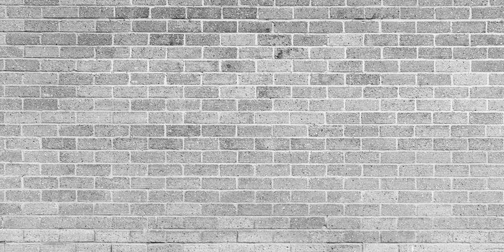 Fototapeta Gray brick wall, frontal view. Background
