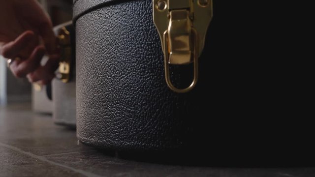Acoustic guitar case in black - 4k footage 