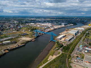 Fototapeta premium The Tees Transporter Bridge that crosses the river Tees between stockton and Middlesbrough. The bridge is made of steel and over 100 years old