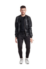 Fototapeta premium Full-length photo of a funny guy dancing in studio isolated on white background.