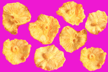 pineapple snacks on a pink background