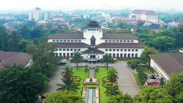 BANDUNG, Indonesia - July 03, 2019: Aerial view of Satay Building or Gedung Sate in Bandung city, West Java, Indonesia. Shot in 4k resolution from a drone flying forwards
