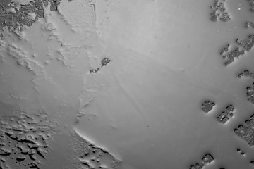 Black background table flooded with water.