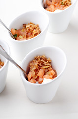 Red salmon canape portion, raw fish. Top view catering banquet table with different food snacks and appetizers. Cold snacks, close up. iIsolated on white background. Party food.