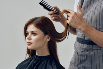 Fototapeta premium hairdresser with scissors and comb