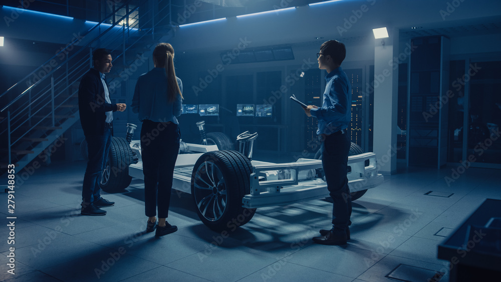 Aufkleber team of automobile design engineers in automotive innovation facility working on electric car platfo