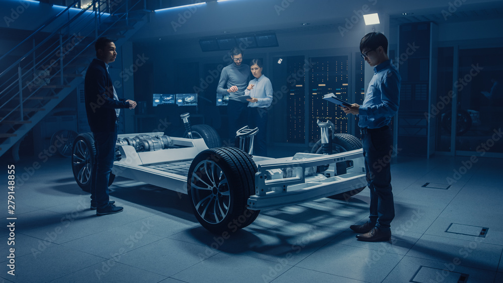 Leinwandbilder automobile design engineers working on electric car platform chassis prototype, using cad software f