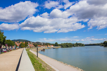 Fototapeta na wymiar River bank with beautiful views of a small village in Hungary