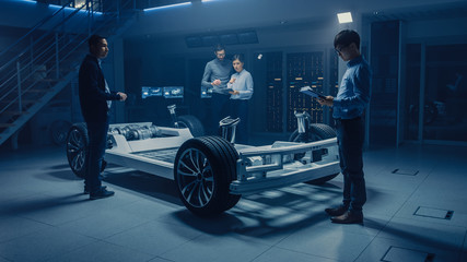 Automobile Design Engineers Working on Electric Car Platform Chassis Prototype, Using CAD Software...