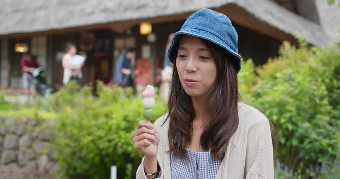 Woman eat dango in the countryside