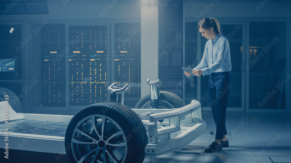 Aufkleber Automobile Engineer Working on Electric Car Chassis Platform, Using Tablet Computer Augmented Reality with 3D CAD Software Modelling. Innovative Facility: Vehicle Frame with Wheels, Engine, Battery