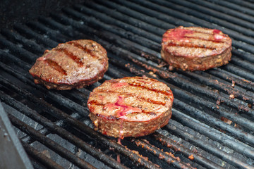 Outdoor grilling of ground beef hamburgers