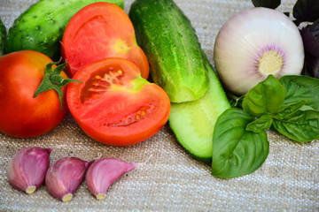 Fresh vegetables. Tomatoes, cucumbers, garlic, onions, basil	